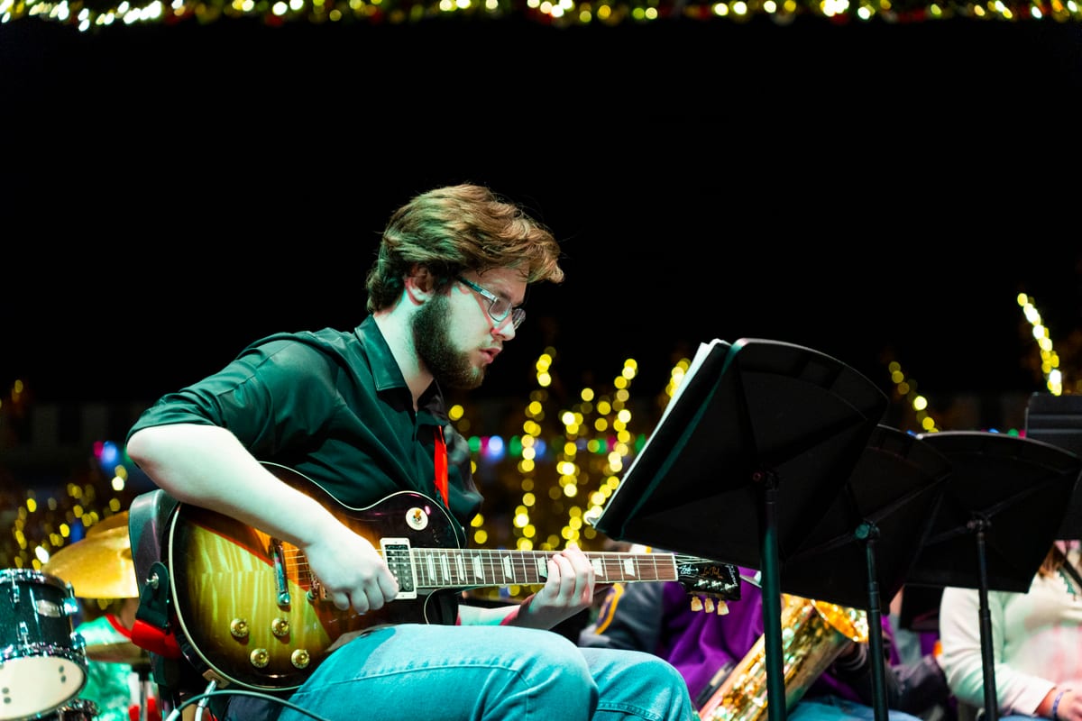Musician performing live at Midland's Merry Lights